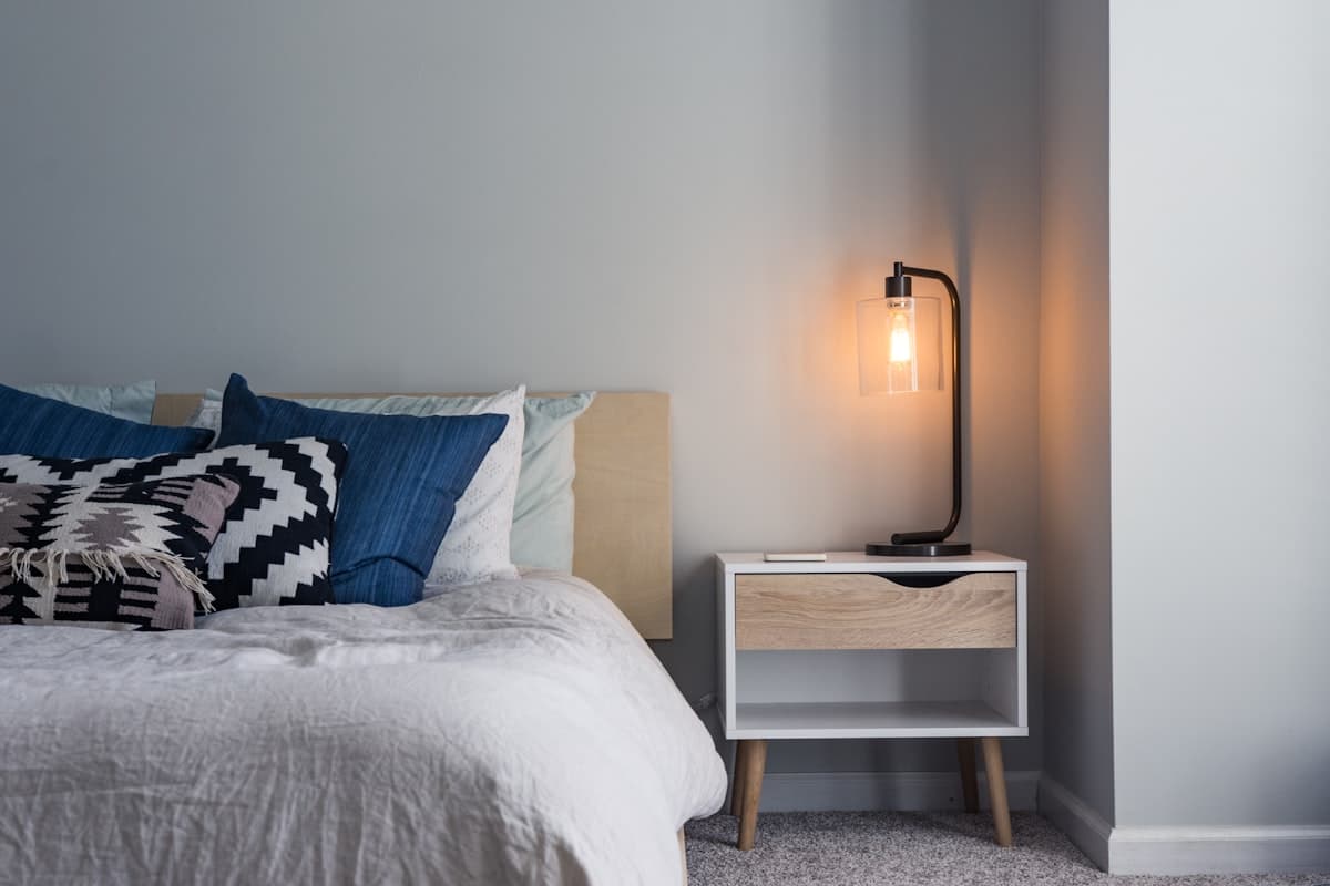 Clean, furnished bedroom in a Rooted Co-Living sober living home in Corona